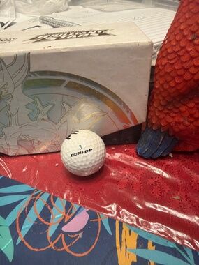 Dunlop DDH golf ball featuring a "3" marking.